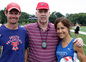 Announcer Pete Taylor is flanked by Nick Berra and Lorraine Jasper.