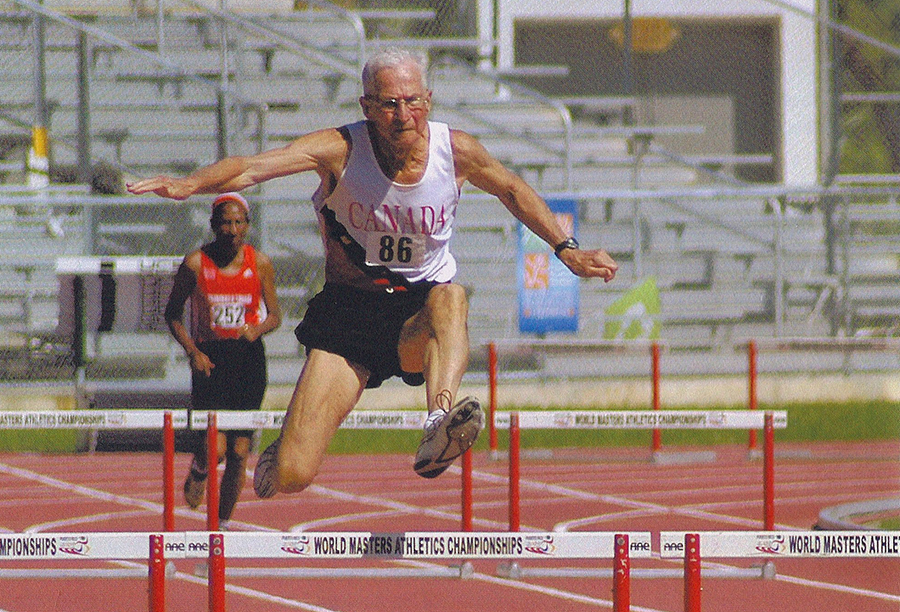 Earl flies in a 200-meter hurdles race that set M80 world record of 36.95.