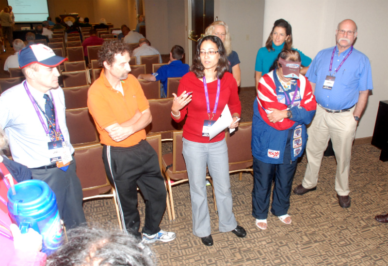 Latashia, in red, was the center of attention in the active athletes scrum. Mary Trotto (looking down) knew her minutes as rep were numbered.