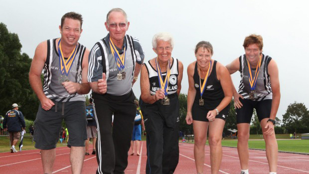 Bruce, second from left, is shown in 2012 with members of the Lodge Frankton Athletic and Harrier Club. Photo by Shane Morton