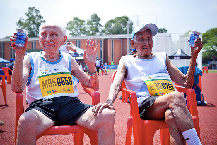 The essence of masters track — relaxing with a friend after hard-fought race.